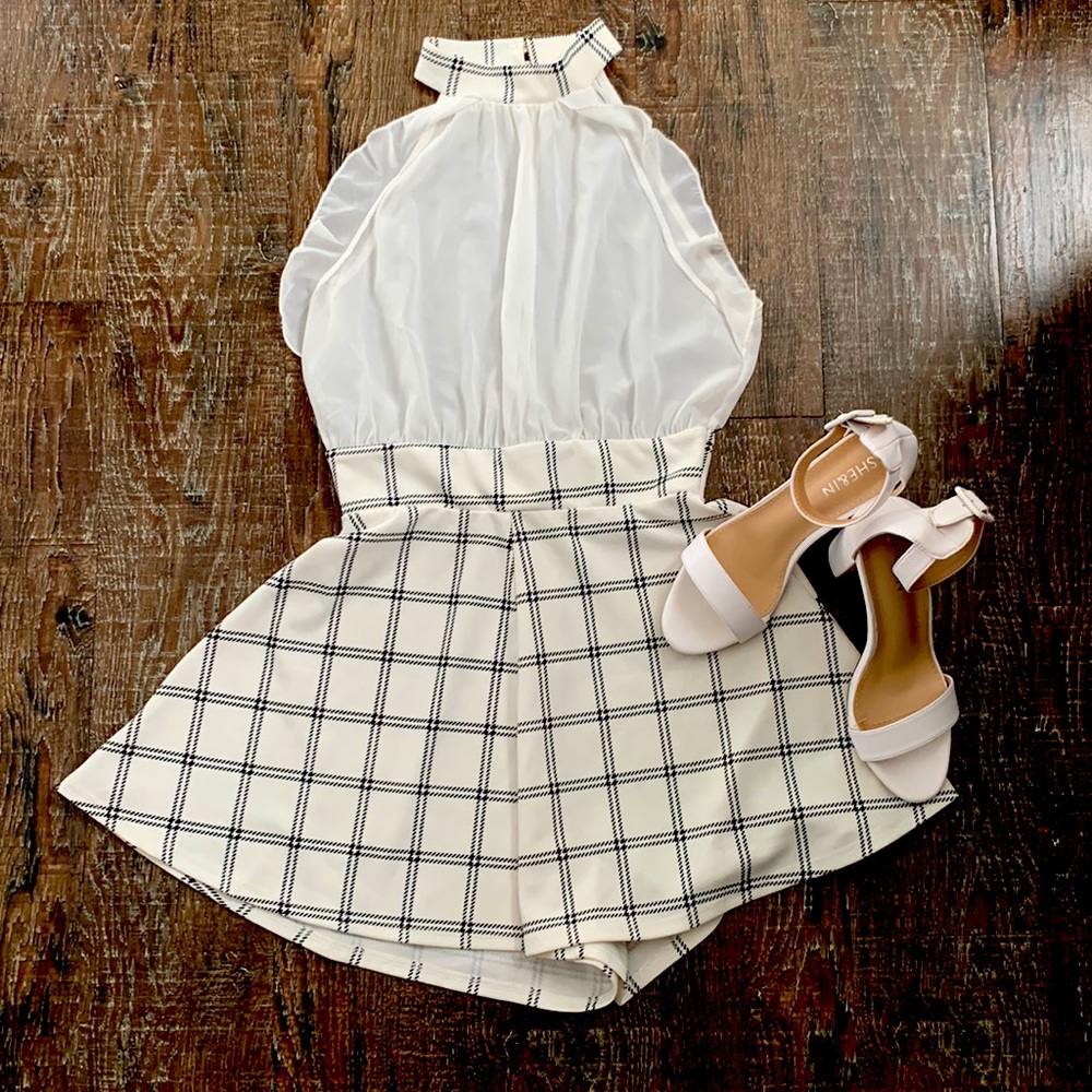 Whit romper from the brand event, The size is a medium/small.